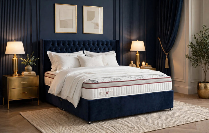 Activ 1000 Mattress with Dark Navy Velvet Divan Base and Tall Buttoned Winged Headboard in Luxury Modern Bedroom with Gold Bedside Tables
