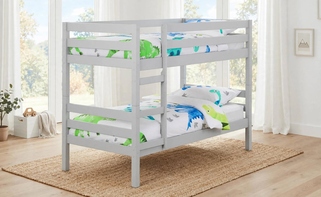 Camden bunk bed in dove grey solid pine slatted frame with ladder green blue dinosaur duvet set bedding front angled view - St James Beds