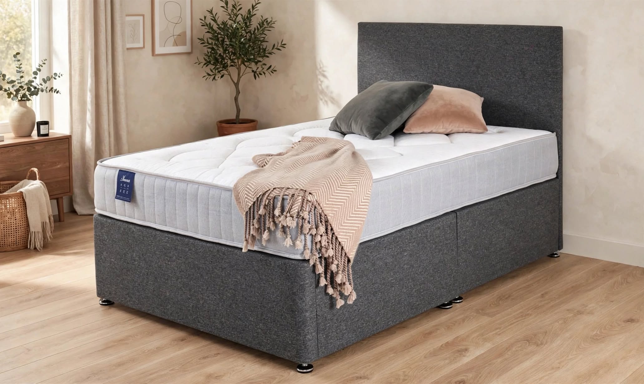 Carnaby open coil divan set in silver glade damask with matching base and tall headboard in modern neutral bedroom with wood floor - St James Beds Kings Lynn