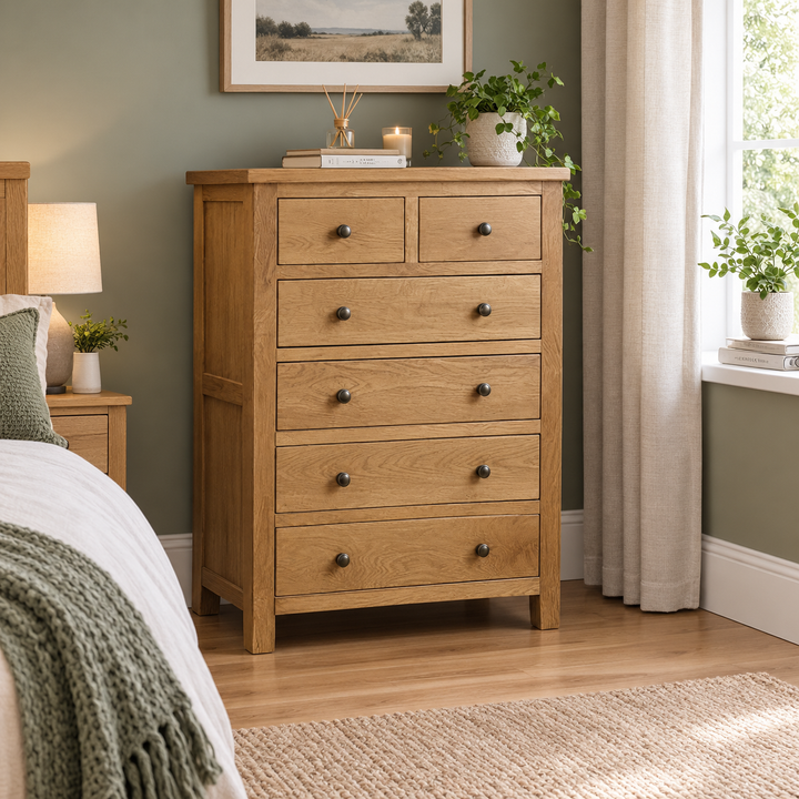 Marlborough natural oak 5-drawer chest in a modern bedroom – St James Bed Centre, King’s Lynn.