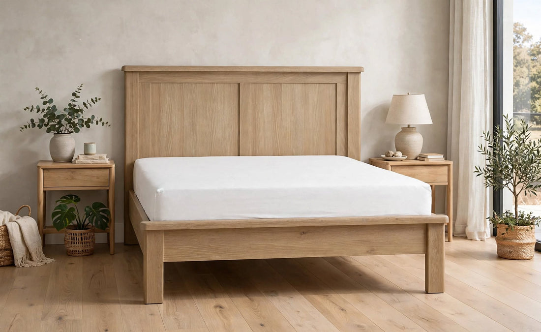 Memphis bed with panelled curved headboard and distinctive curved edging in limed oak with white mattress front view - St James Beds