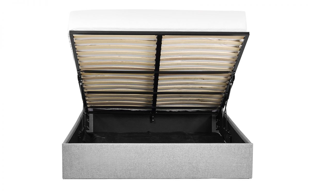 Merida bed showing gas-lift ottoman storage space open"