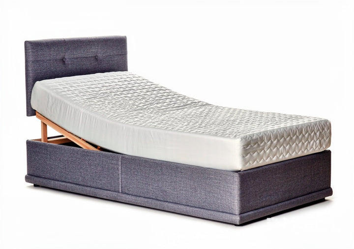 Adjustable bed with memory foam mattress from St James Bed Centre, featuring a sleek design and customizable head and foot positions.