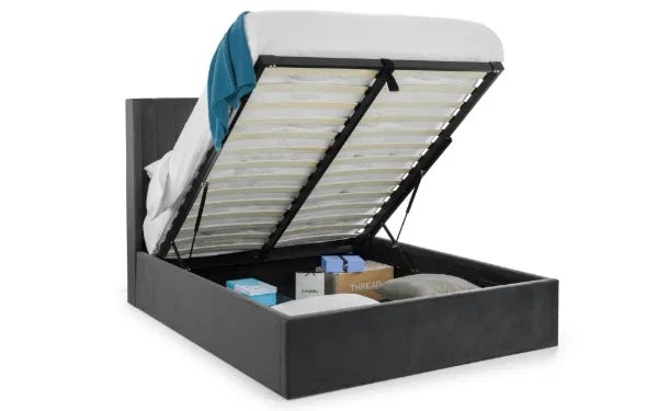 Grey Langham Storage Bed with scalloped headboard and wooden legs, featuring a spacious storage base and elegant design.